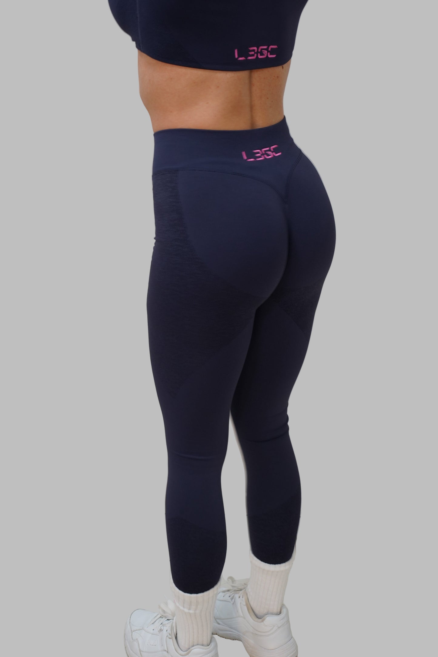 woman wearing navy blue leggings with L3GC branding