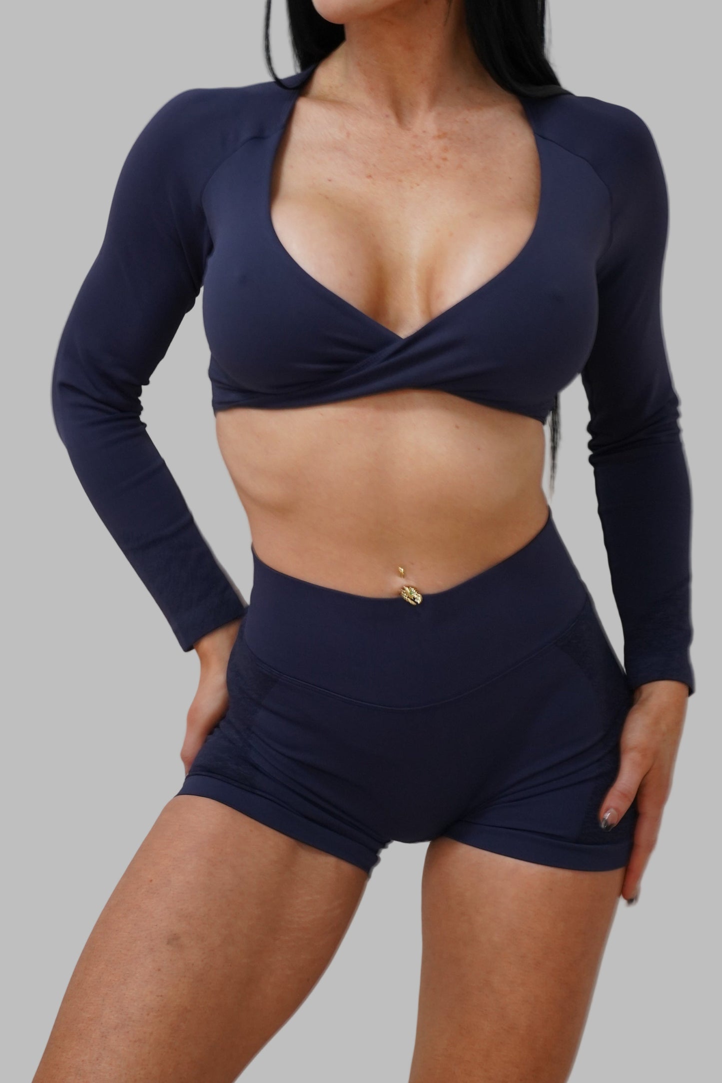Woman in navy blue athletic outfit