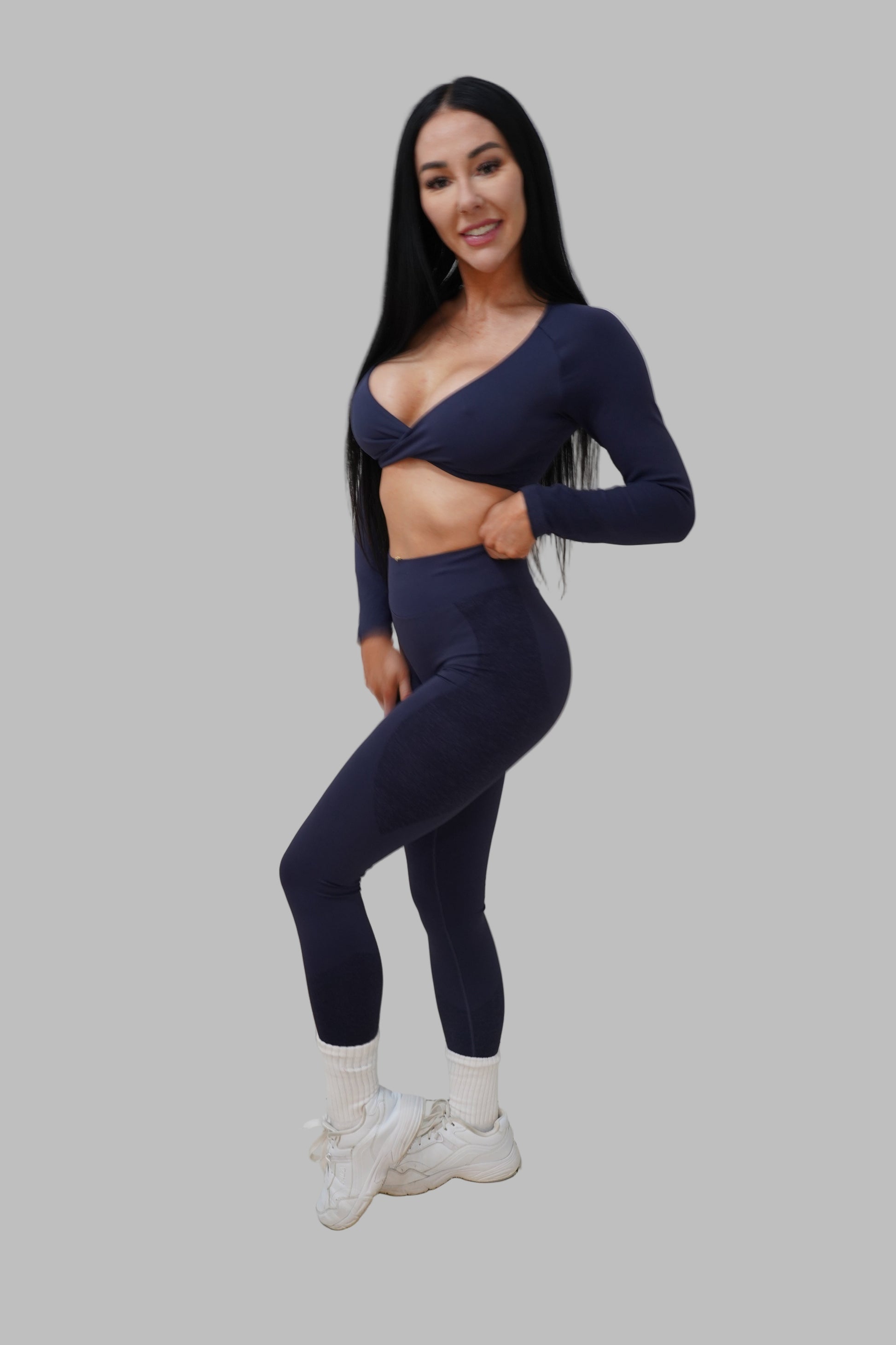 woman wearing navy blue athletic outfit.