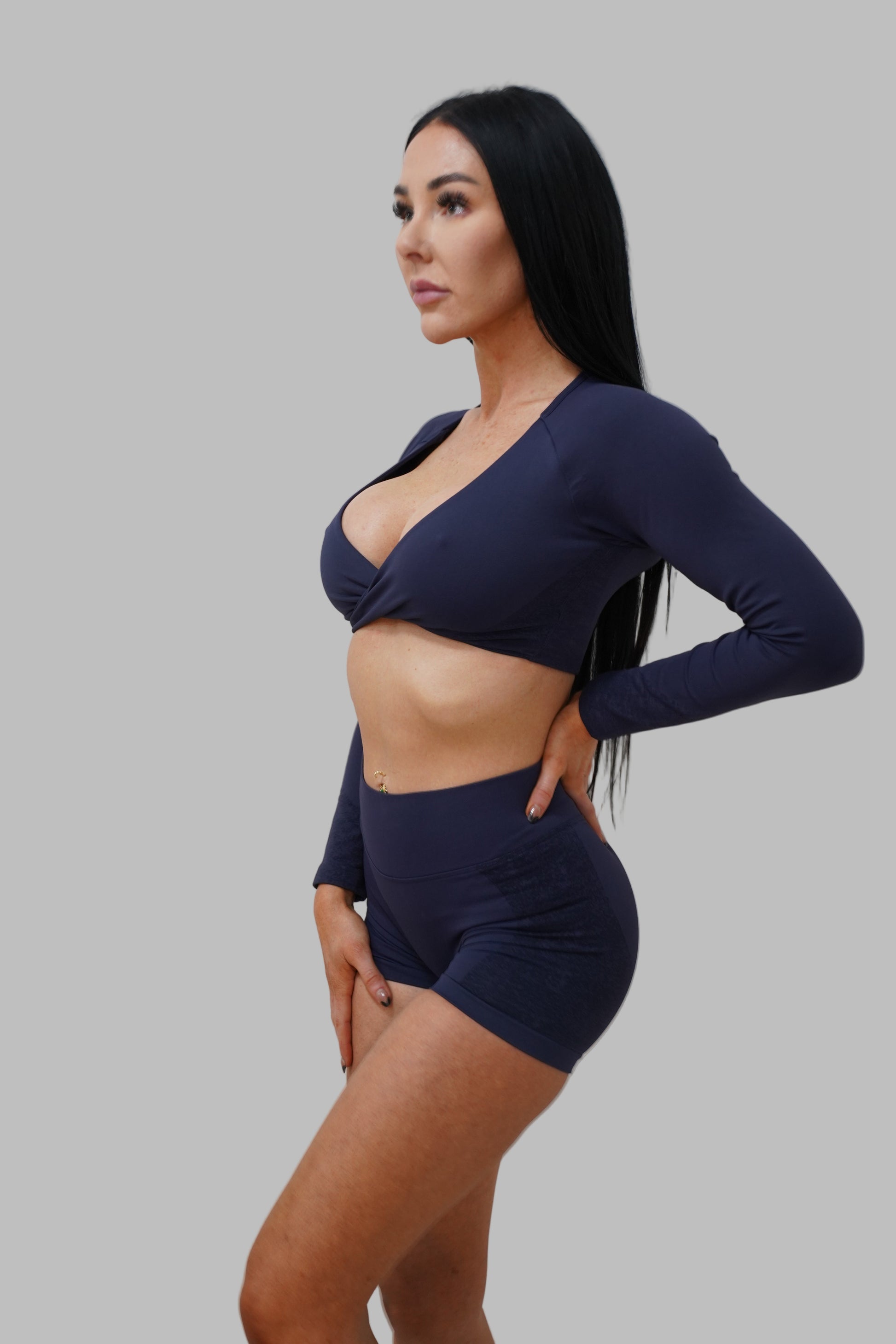 Woman in a navy blue outfit.