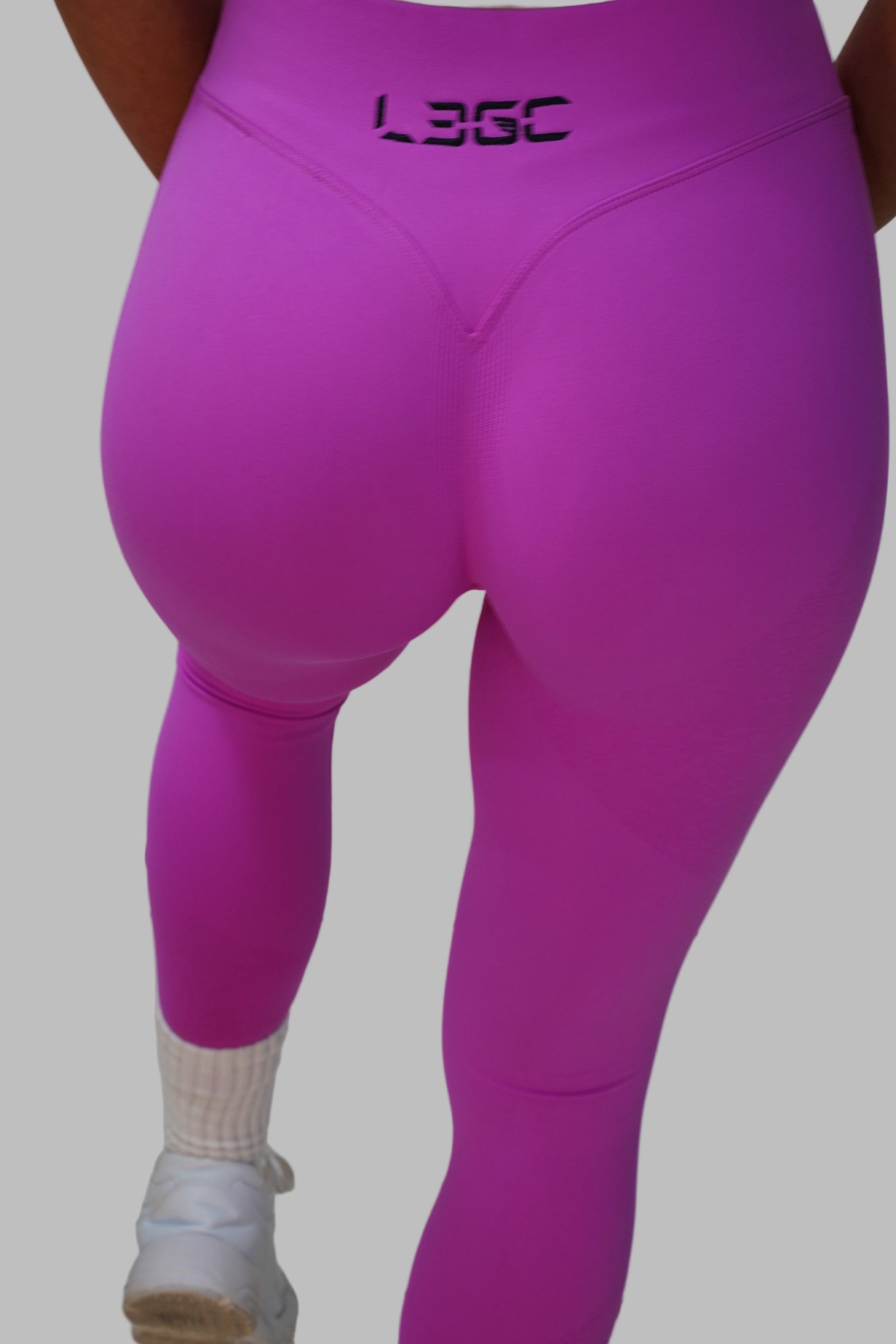 Pink leggings with LEGC brand logo.
